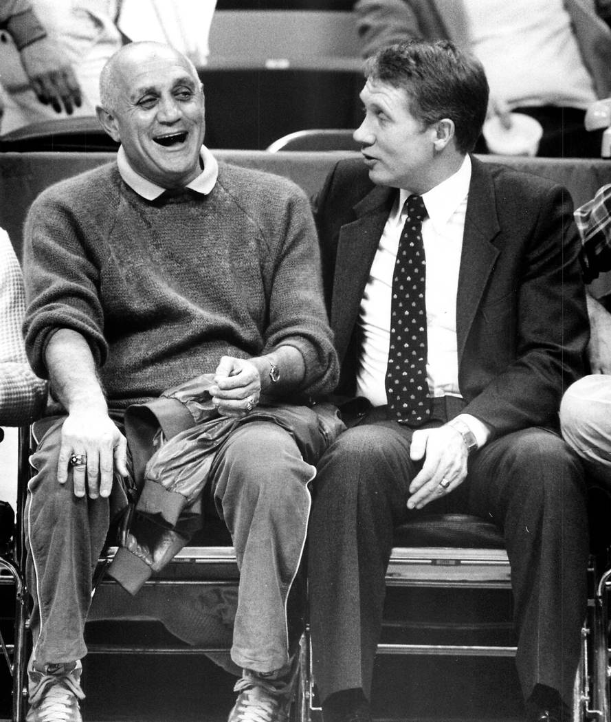 Harry Reid sits courtside with Jerry Tarkanian in December 1983. (File Photo)