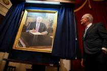 U.S. Sen. Harry Reid, D-Nev., looks at a portrait of himself after it was unveiled during a cer ...