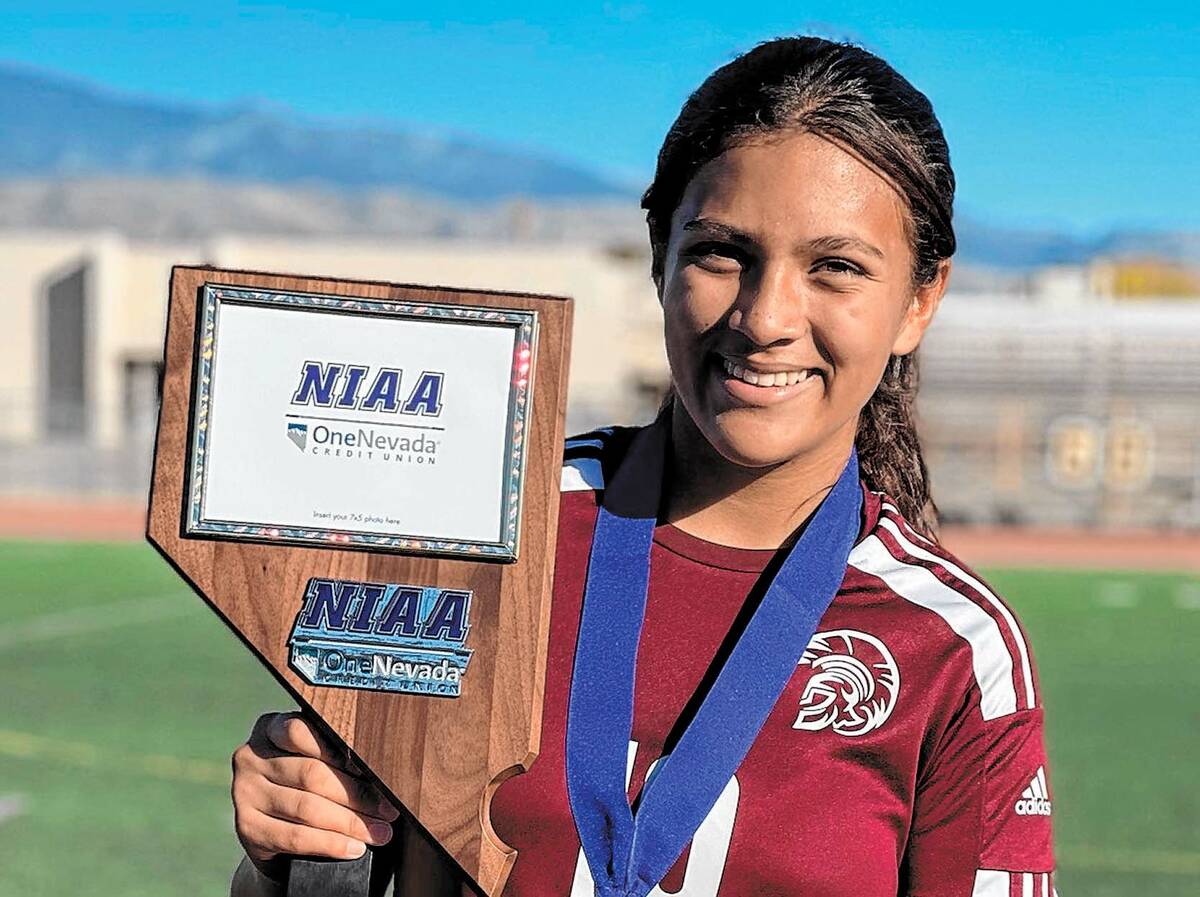 Special to the Pahrump Valley Times/ Kailani Martinez holding up the 3A Nevada State Championsh ...