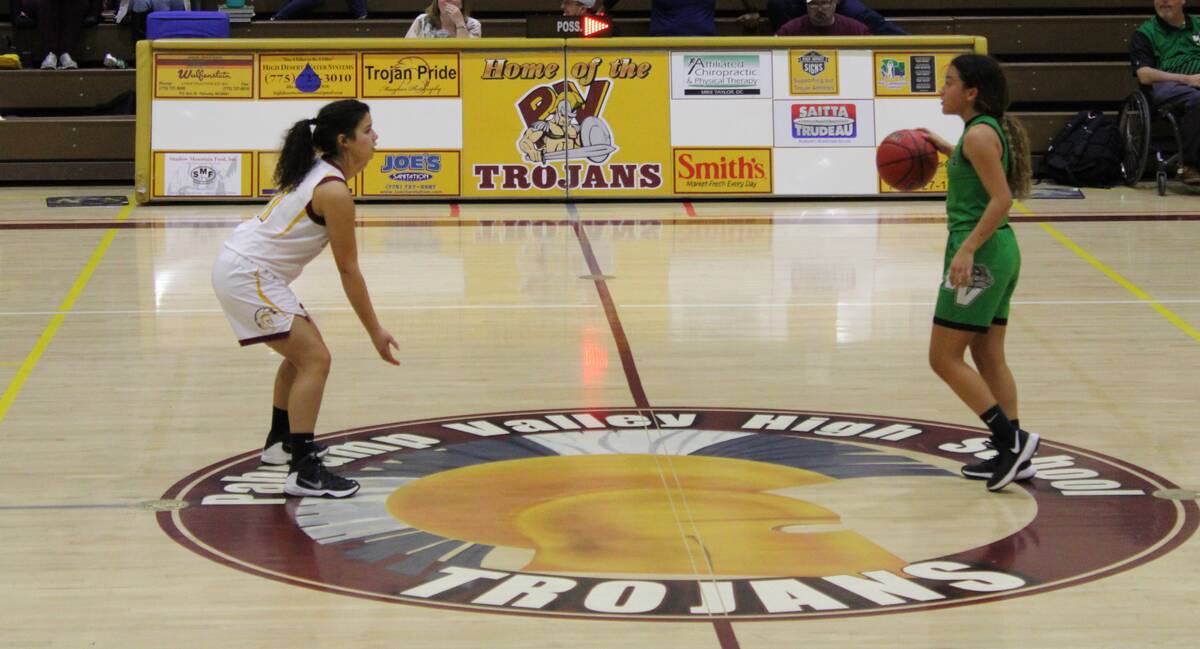 Danny Smyth/Pahrump Valley Times Helianne Sutton defends a Virgin Valley player during their ga ...