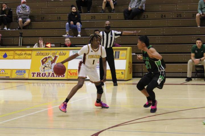 Danny Smyth/Pahrump Valley Times Pahrump Valley guard Ewayne Brown (1) looks to drive past a V ...