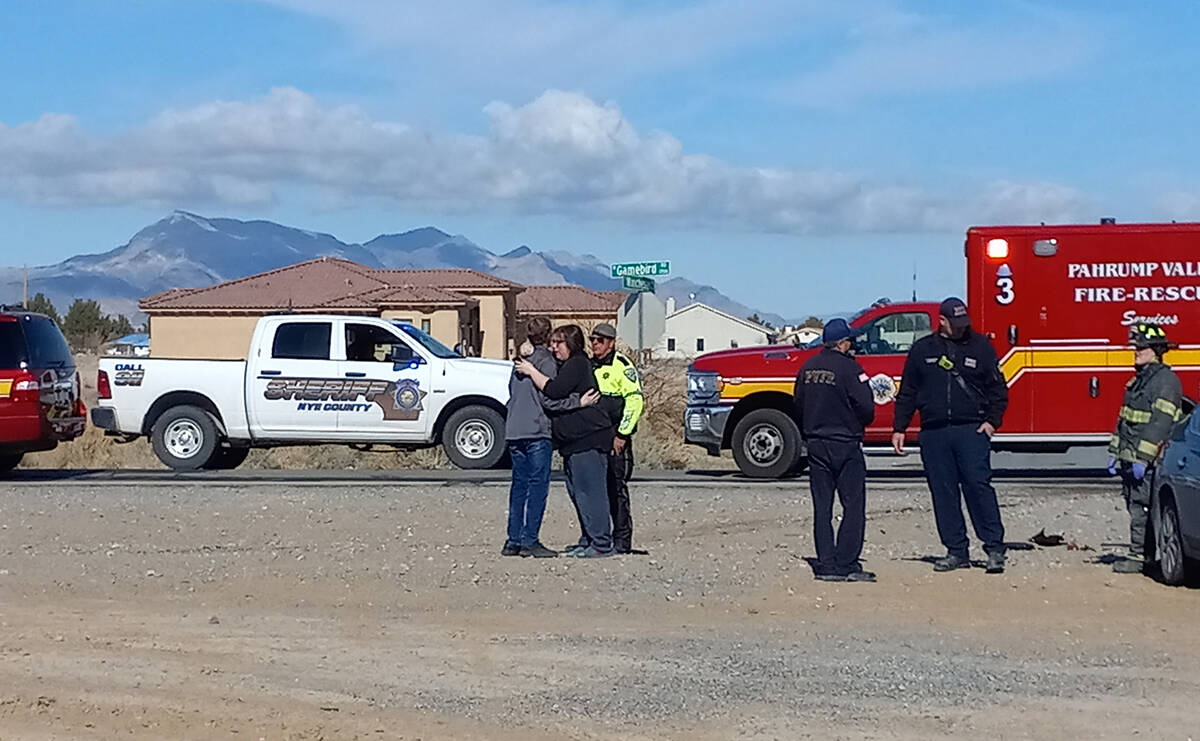 Selwyn Harris/Pahrump Valley Times Visibly distraught family members arrived on scene as medics ...