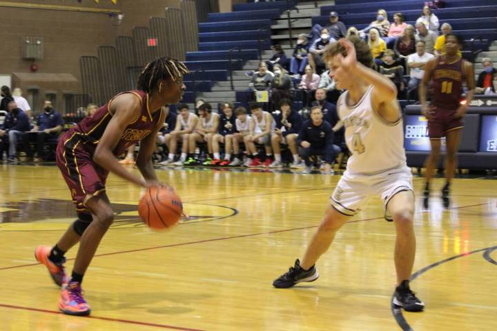 Danny Smyth/Pahrump Valley Times Pahrump Valley Trojans guard Ewayne Brown (1) looking to drive ...