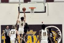 Pahrump Valley Trojan guard Aiden McClard (4) goes up for a layup in their 71-50 win over Pinec ...