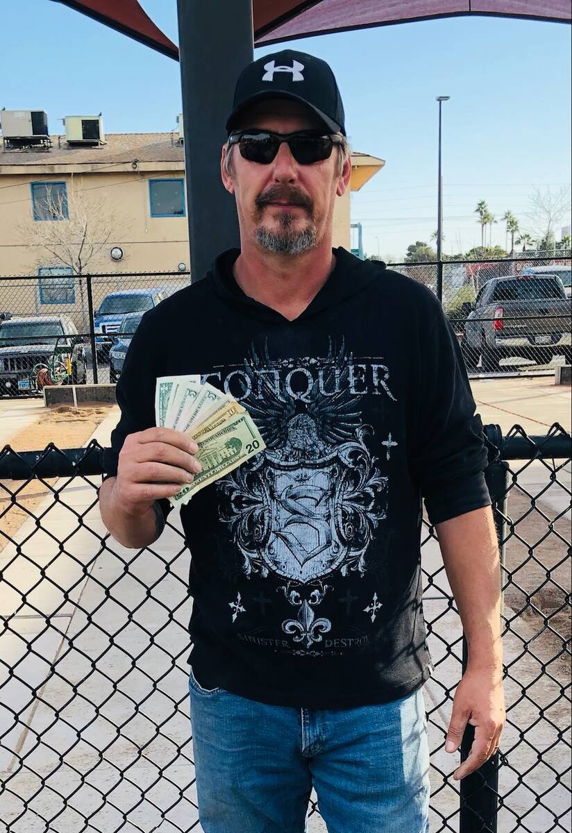 Special to the Pahrump Valley Times Heath Russell poses with his 50/50 raffle winnings after f ...
