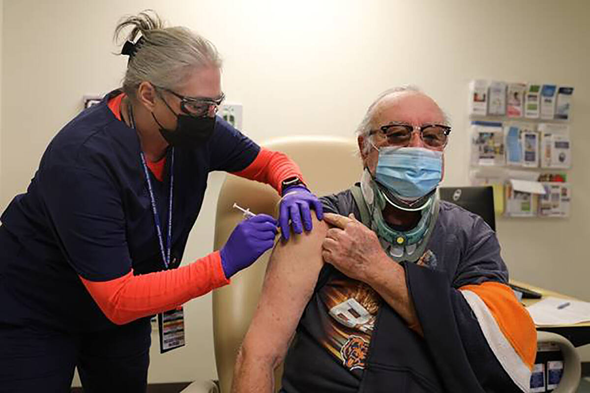 Frank Duszynski Jr., 72, received his first dose of the Pfizer-BioNTech COVID-19 vaccine in thi ...
