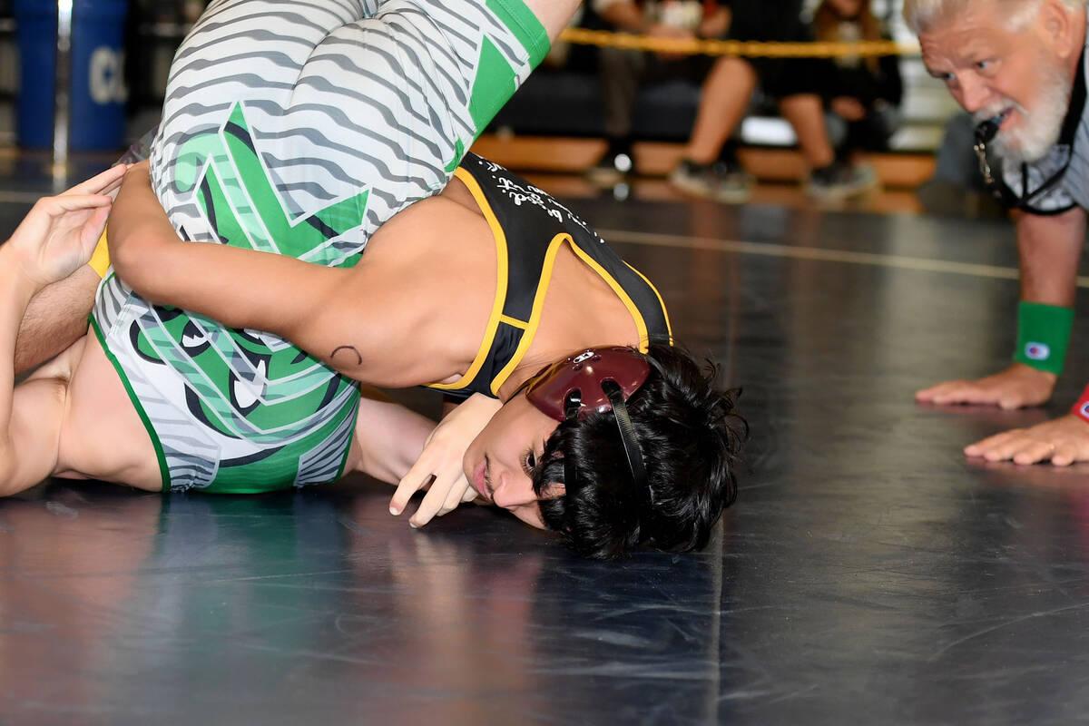 Chris Vega, wrestling in the 126-pound division.