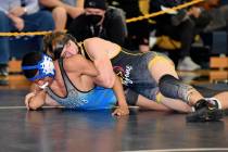 Peter Davis/Pahrump Valley Times Brennan Benedict, wrestling in the 138-pound division.