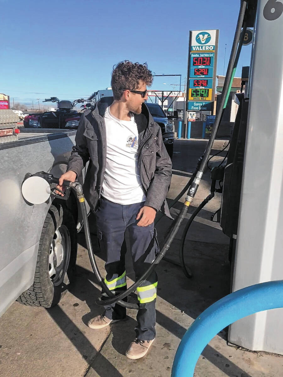 Brandon Ferguson pumps gas at Valero in Tonopah on Wednesday morning. The station was selling g ...