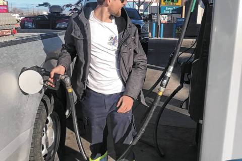 Brandon Ferguson pumps gas at Valero in Tonopah on Wednesday morning. The station was selling g ...