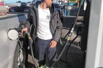 Brandon Ferguson pumps gas at Valero in Tonopah on March 16. The station was selling gas for $5 ...