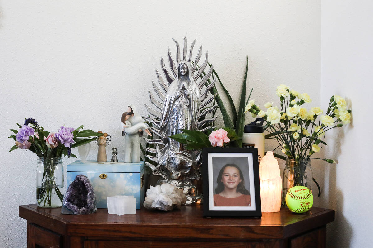 A table with a portrait of Georgia Durmeier and her ashes in a box at the home of her mother Ch ...