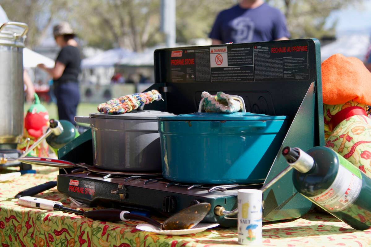 Cooks prepare their red chili before presenting it to the chili judges for the ninth annual Sil ...