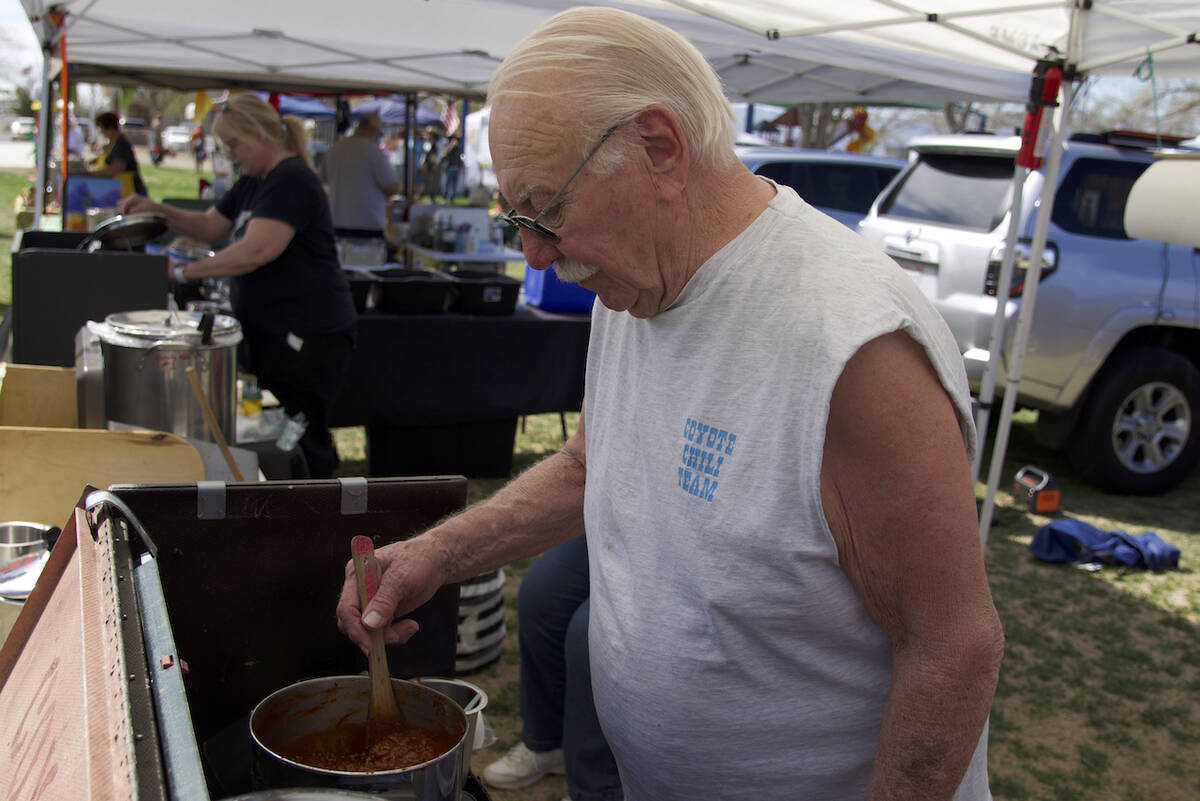 Jim Watson, with Coyote Chili from Nampa, Idaho, stirs his chili for the ninth annual Silver St ...