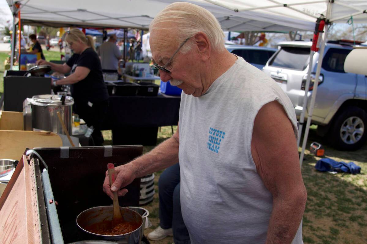 Jim Watson, with Coyote Chili from Nampa, Idaho, stirs his chili for the ninth annual Silver St ...