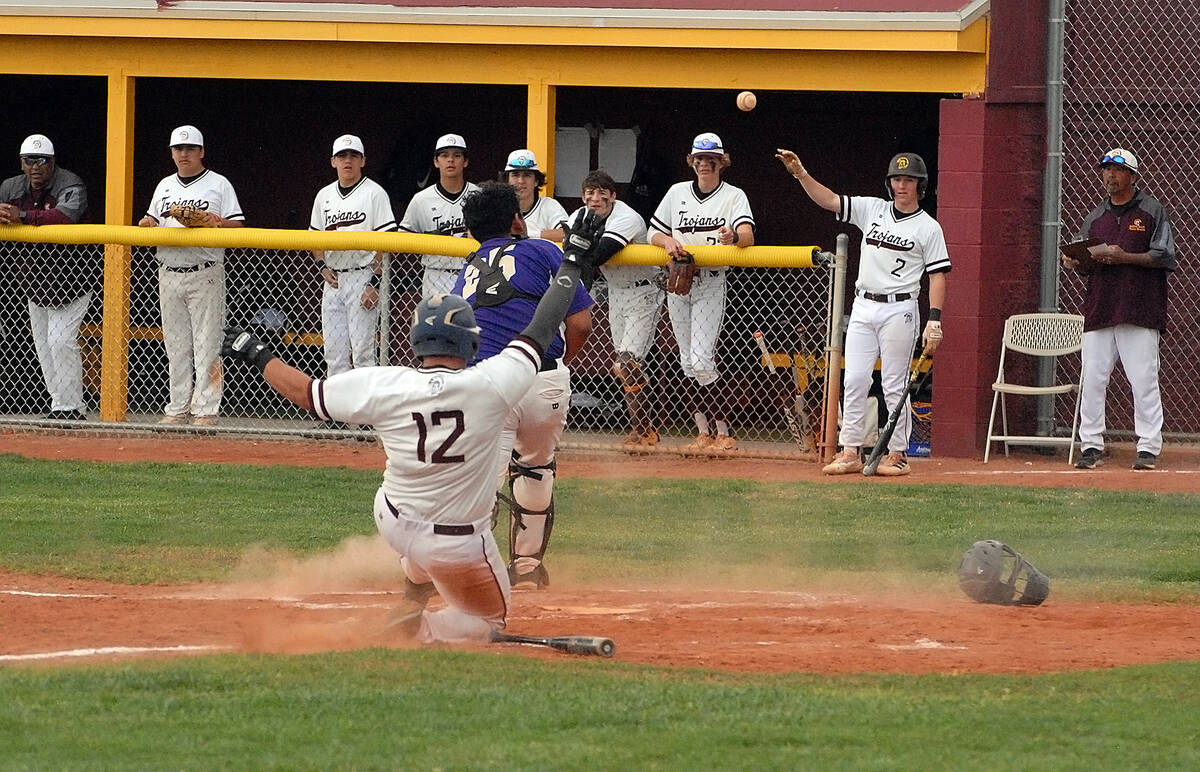 Horace Langford Jr./Pahrump Valley Times Senior Dallton Norland slides into home plate for one ...