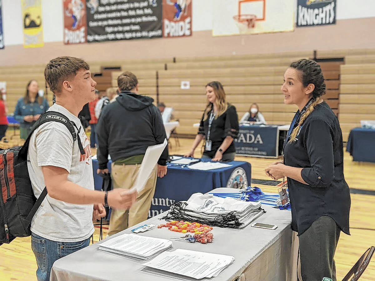 Tonopah senior Talon Smith talks with Brittany Marich from the Department of Health and Human S ...