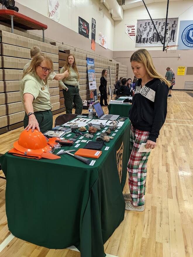Department of Agriculture Forest Service employee Carolyn Helm talks with Tonopah eighth-grader ...