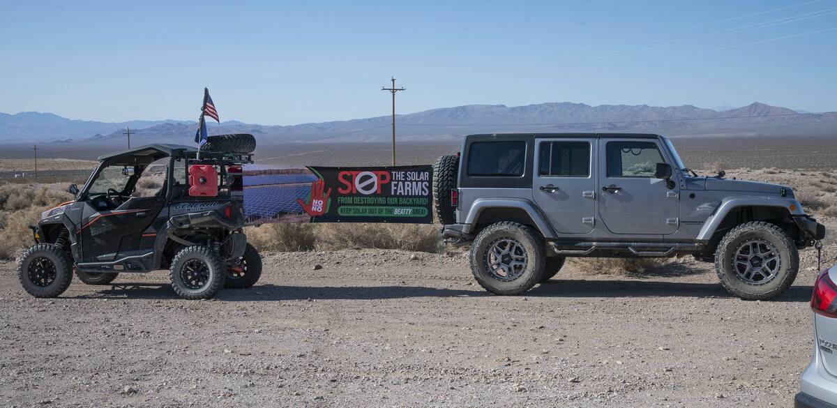 Richard Stephens/Special to the Pahrump Valley Times Two vehicles with an anti-solar banner are ...