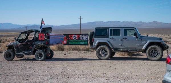 Richard Stephens/Special to the Pahrump Valley Times Two vehicles with an anti-solar banner are ...
