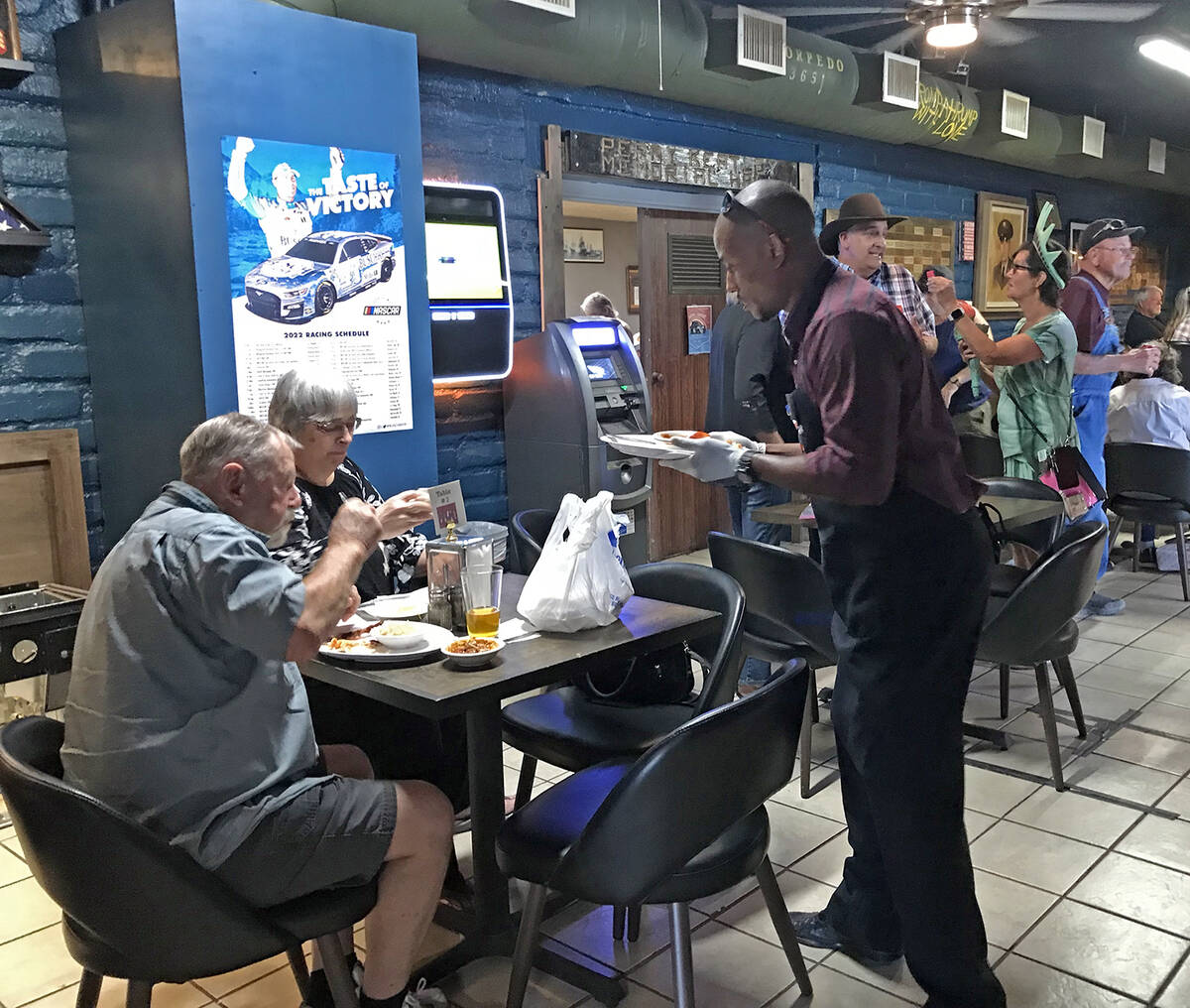 Robin Hebrock/Pahrump Valley Times A volunteers is pictured serving a plate to patrons at the " ...