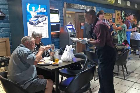 Robin Hebrock/Pahrump Valley Times A volunteers is pictured serving a plate to patrons at the " ...