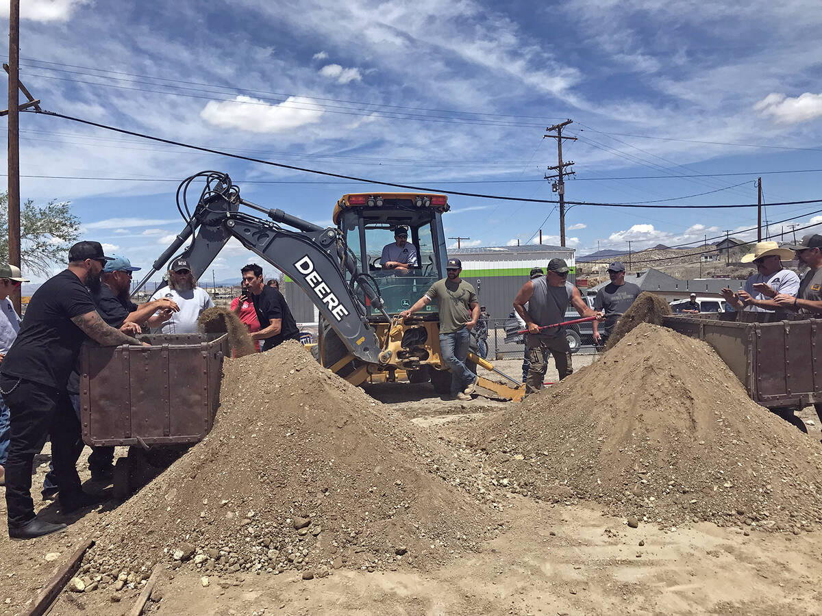 Robin Hebrock/Pahrump Valley Times Competitors are pictured mucking dirt as fast as they possib ...
