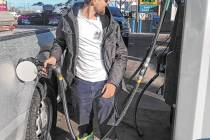 (Charity Wessel/Times-Bonanza) Brandon Ferguson pumps gas at Valero in Tonopah in March 2022 wh ...