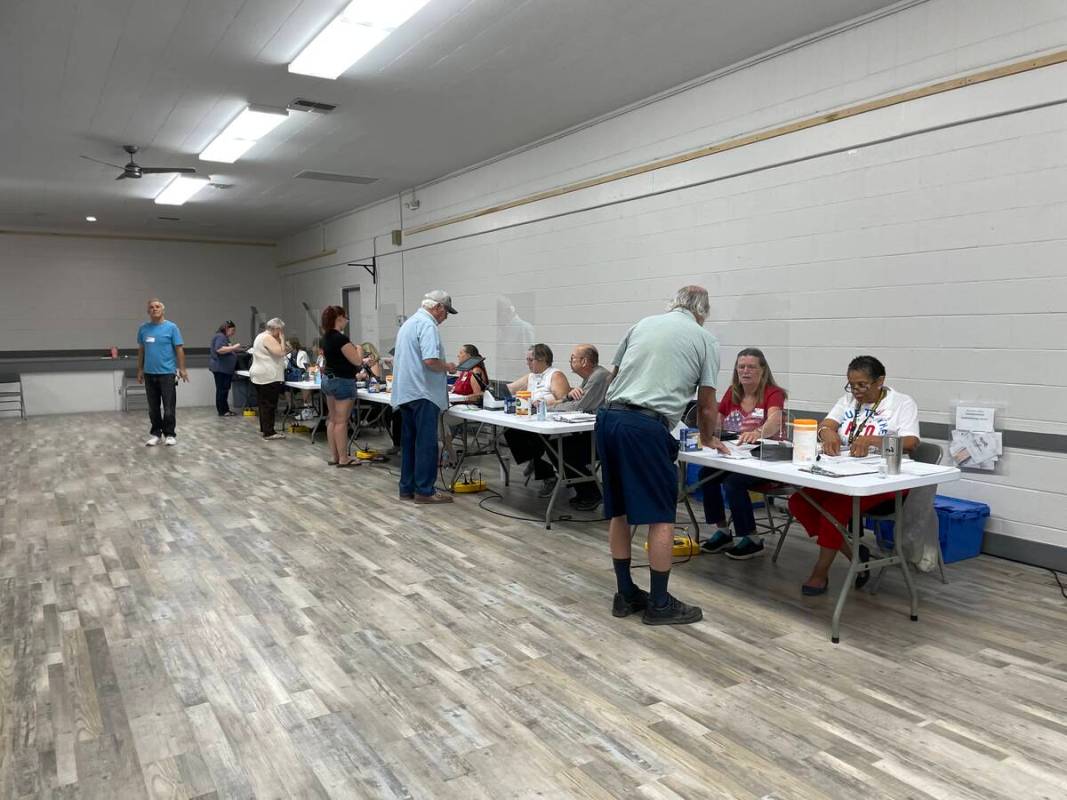 (Faye Burdzinksi/Pahrump Valley Times) Voters and poll workers on Tuesday, June 14 at the Bob ...