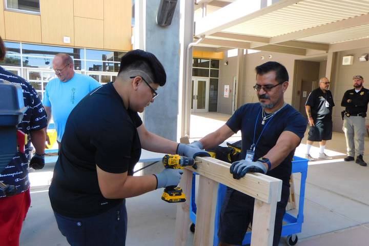 Robin Hebrock/Pahrump Valley Times Jose Veloz, Nye County Juvenile Probation, right, is picture ...