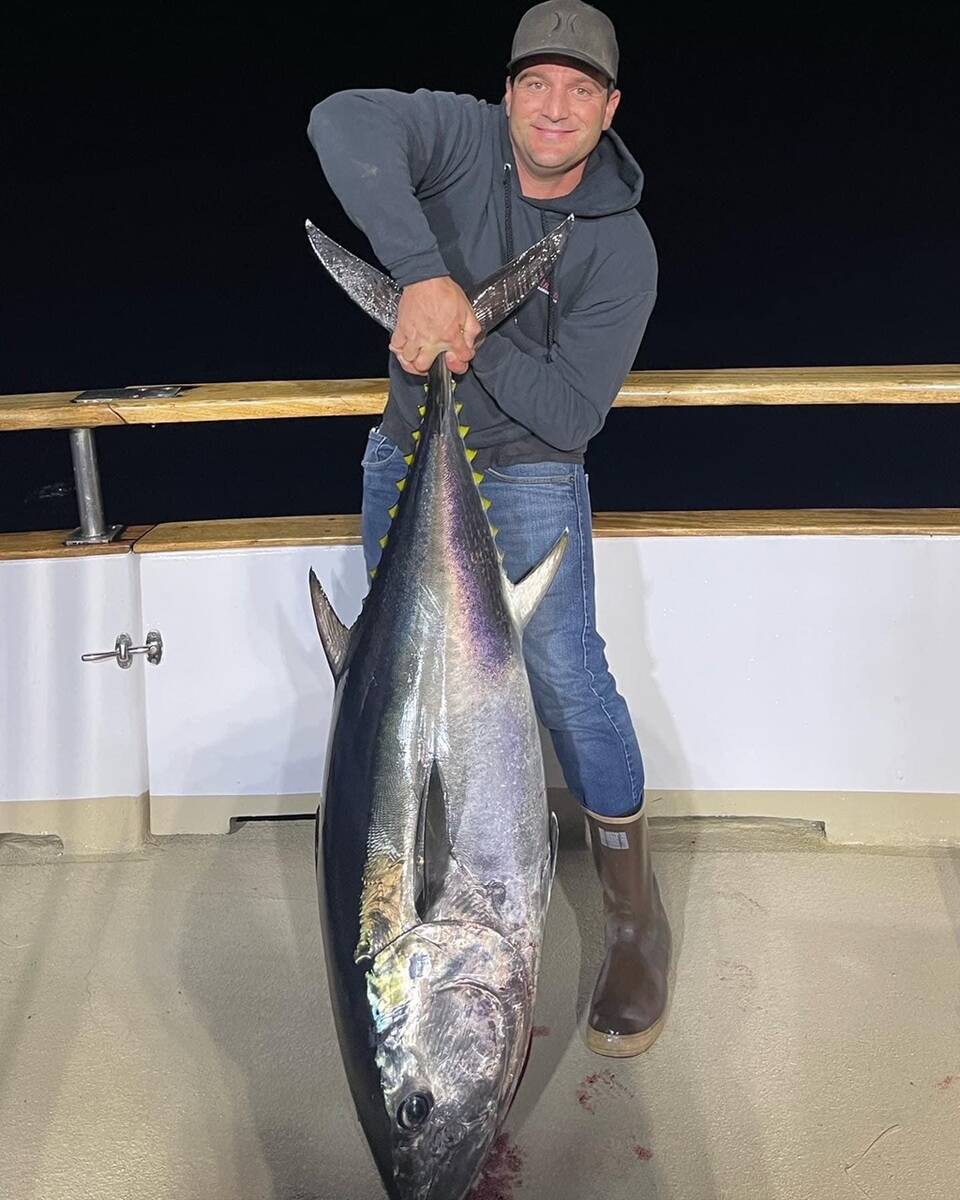 Special to the Pahrump Valley Times A lucky fisherman poses with the catch of the day, a huge B ...
