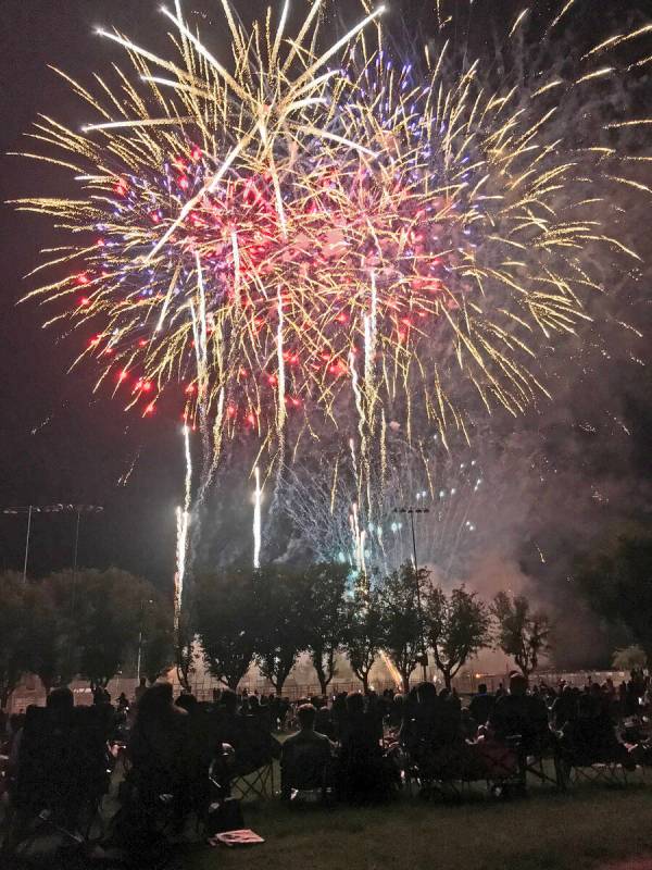 Robin Hebrock/Pahrump Valley Times Glittering bombs burst overhead at Petrack Park during the t ...