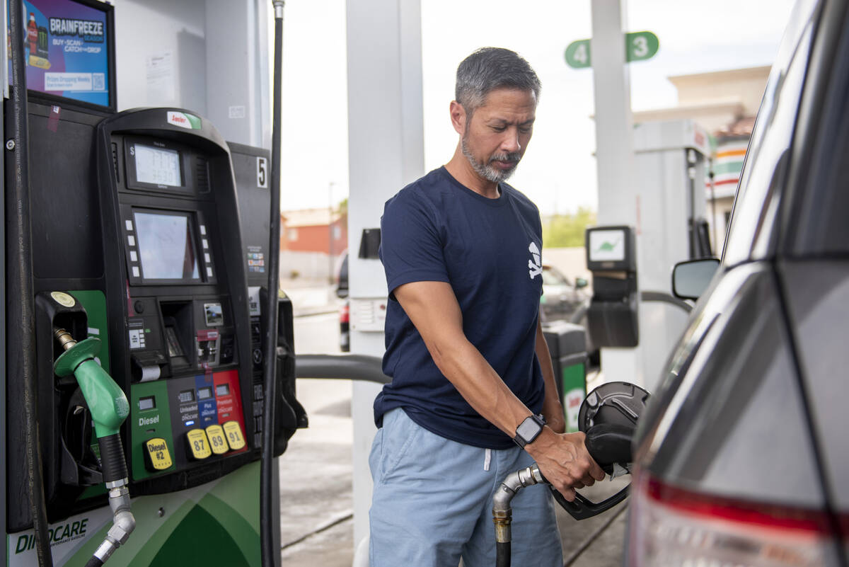 Tony Rodriguez, from San Fransisco, Calif., pumps gas at a Sinclair station on South Fort Apach ...