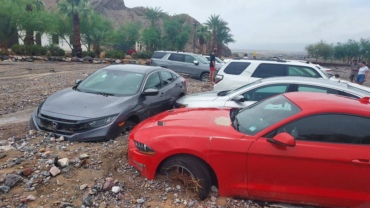 Debris from monsoonal rain immobilized sixty cars, belonging to visitors and park staff, in Dea ...
