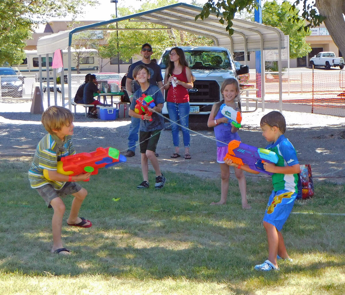 Robin Hebrock/Pahrump Valley Times This file photo shows youngsters enjoying a water-gun fight ...