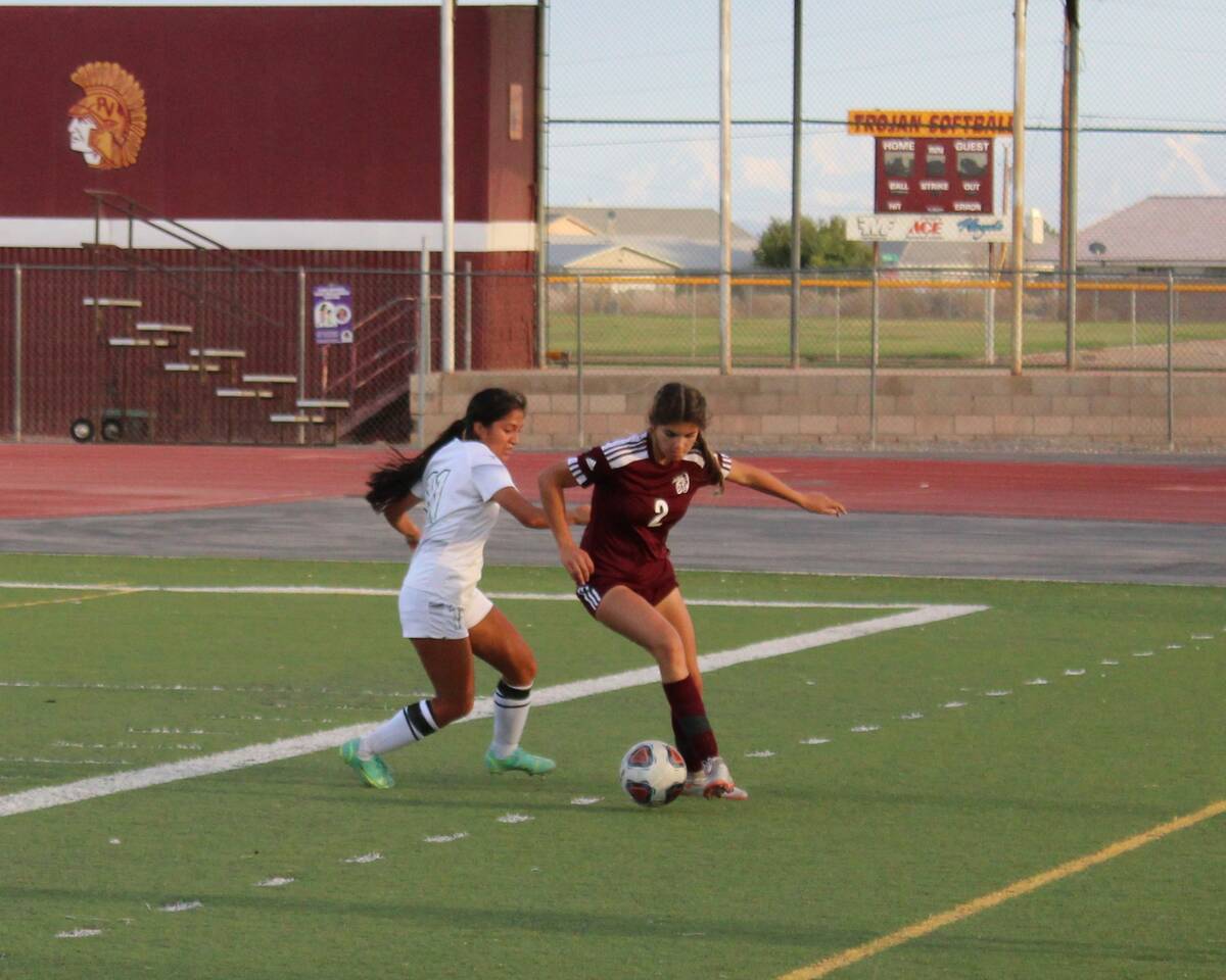 Danny Smyth/Pahrump Valley Times Junior forward Courtney VanHouse (2) fights for the ball agai ...