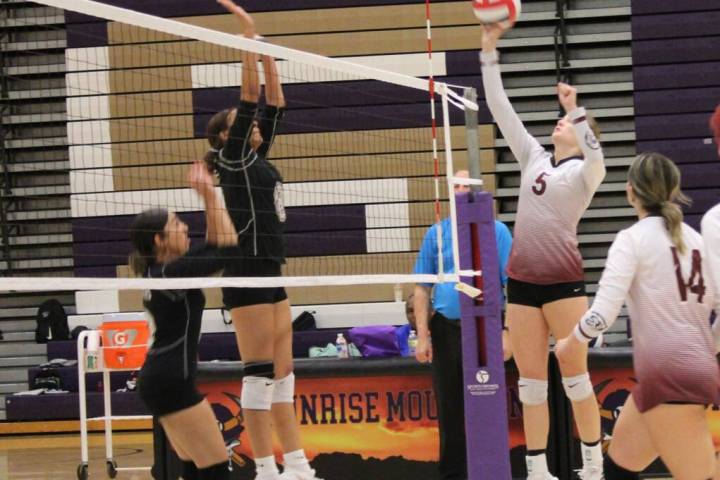Danny Smyth/Pahrump Valley Times Senior captain Peyton Odegard (5) is skying high for a hit aga ...