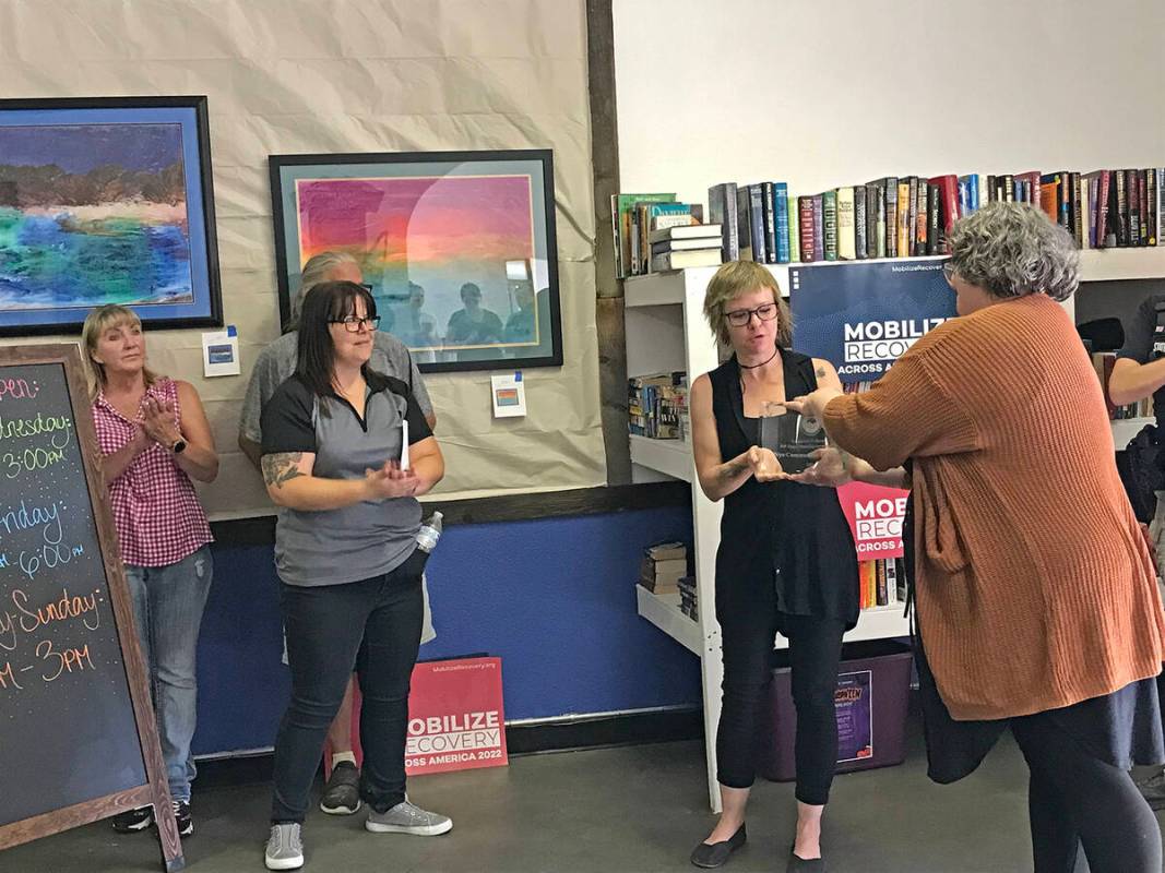 Robin Hebrock/Pahrump Valley Times A NyE Communities Coalition representative is seen receiving ...