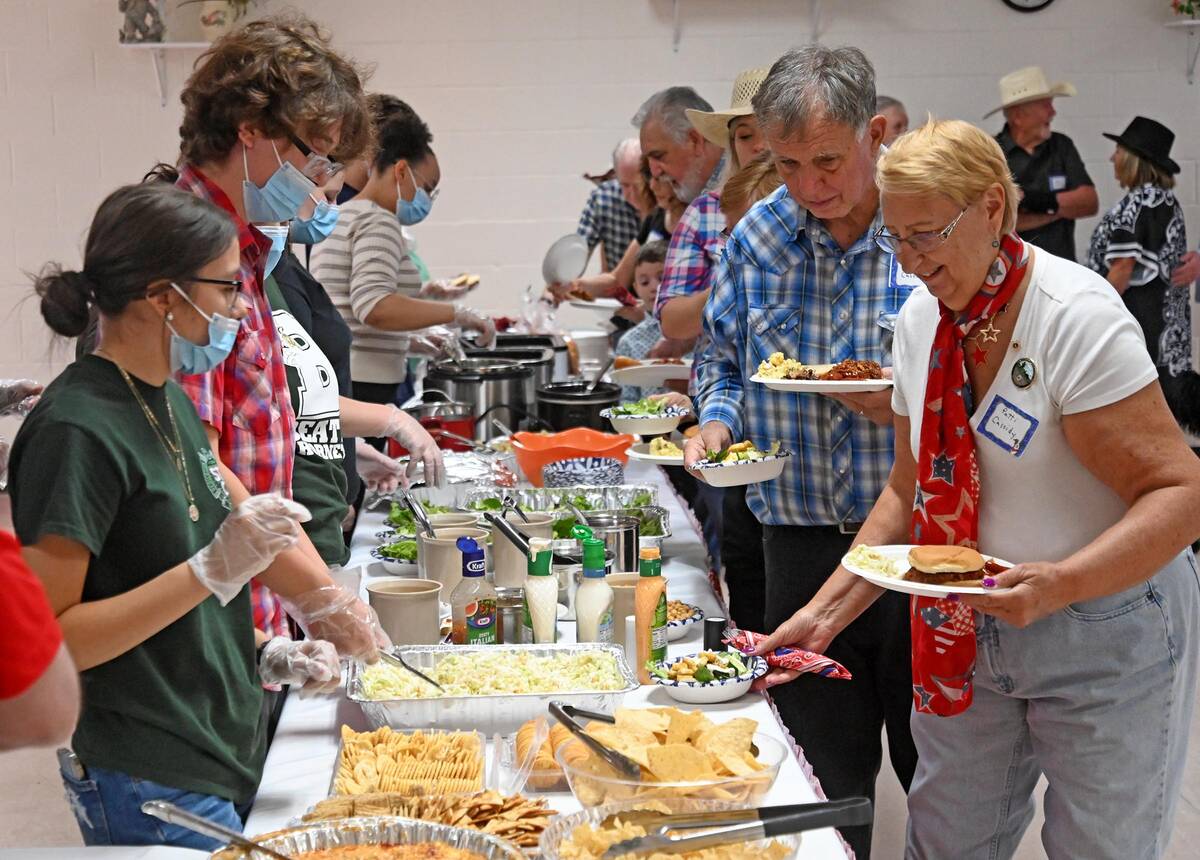 Richard Stephens/Special to the Pahrump Valley Times Attendees fill their plates at the buffet ...
