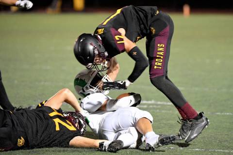 Peter Davis/Pahrump Valley Times Tristan (42) and Kayne Horibe (12) combine for a tackle in th ...