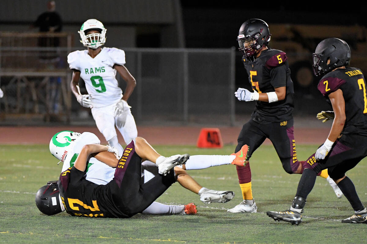 Peter Davis/Pahrump Valley Times Tristan Church (42) makes one of his eight tackles against th ...