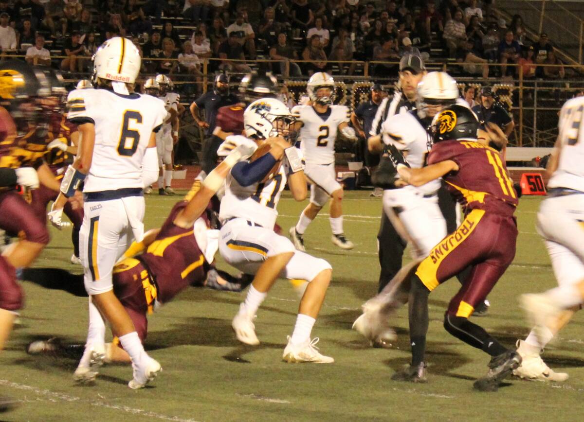 Danny Smyth/Pahrump Valley Times Brennen Benedict (1) makes a tackle against Boulder City's qu ...