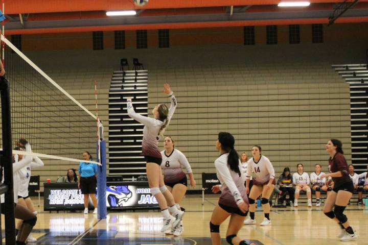 Danny Smyth/Pahrump Valley Times Peyton Odegard (5) goes sky high for a kill in the Trojans' 3 ...