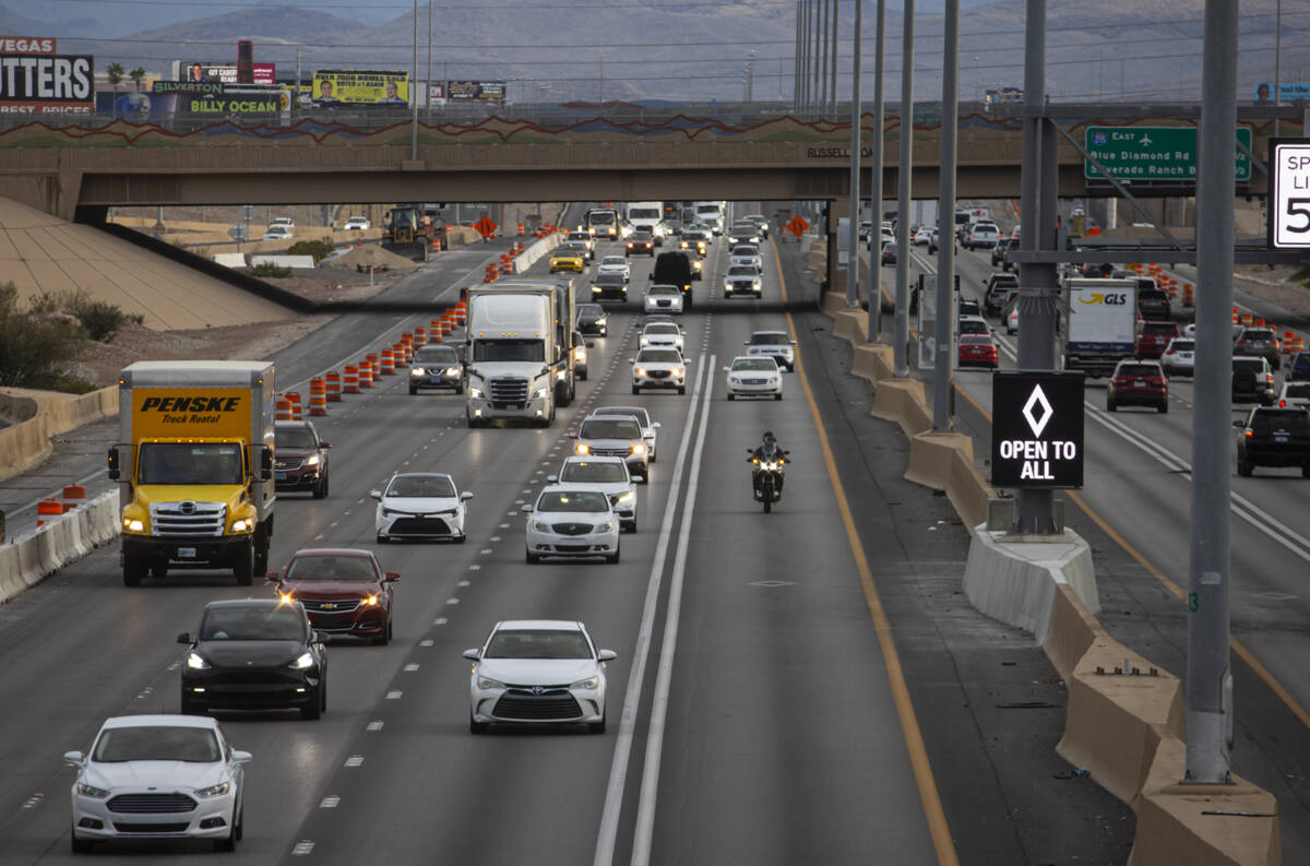 An HOV lane sign denotes that the lane is "open to all" as part of a pilot transporta ...