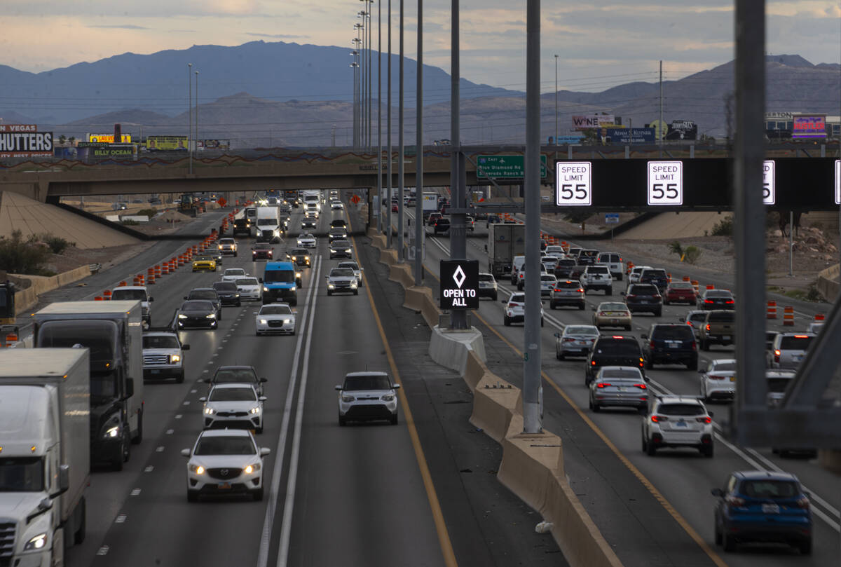 An HOV lane sign denotes that the lane is "open to all" as part of a pilot transporta ...