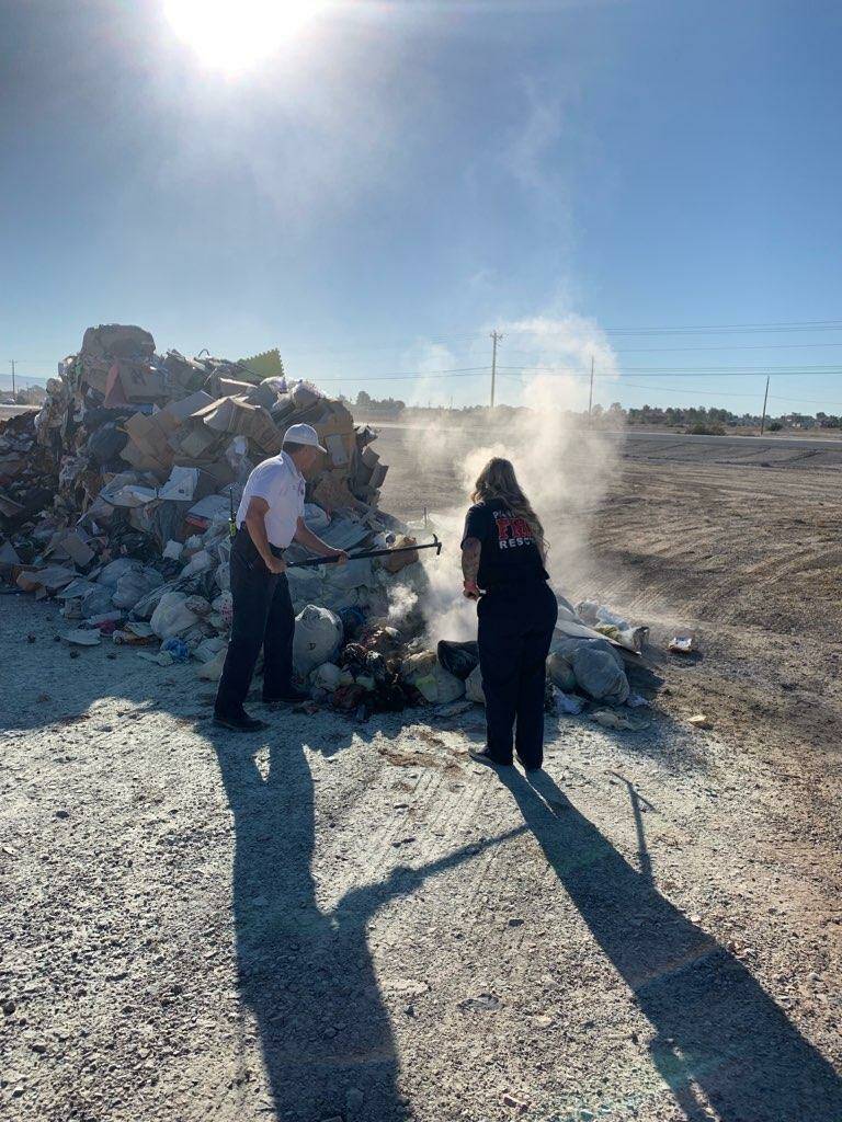 Special to the Pahrump Valley Times Crews battle a blaze on the vacant lot in front of Star Nur ...