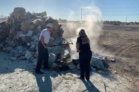 Special to the Pahrump Valley Times Crews battle a blaze on the vacant lot in front of Star Nur ...