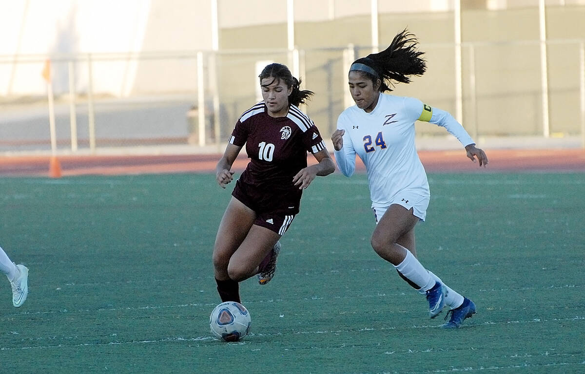 Horace Langford Jr./Pahrump Valley Times Senior midfielder Kailani Martinez (10) fighting off a ...