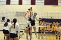 Horace Langford Jr./Pahrump Valley Times Junior Taylor Brown (13) goes up for a block against ...