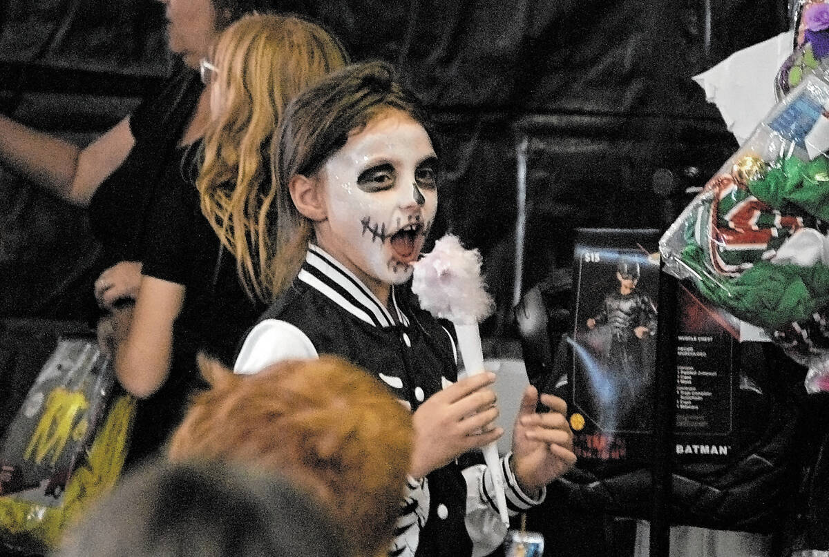 Horace Langford Jr./Pahrump Valley Times - Costume Drive Saturday, Taaler enjoying cotton candy